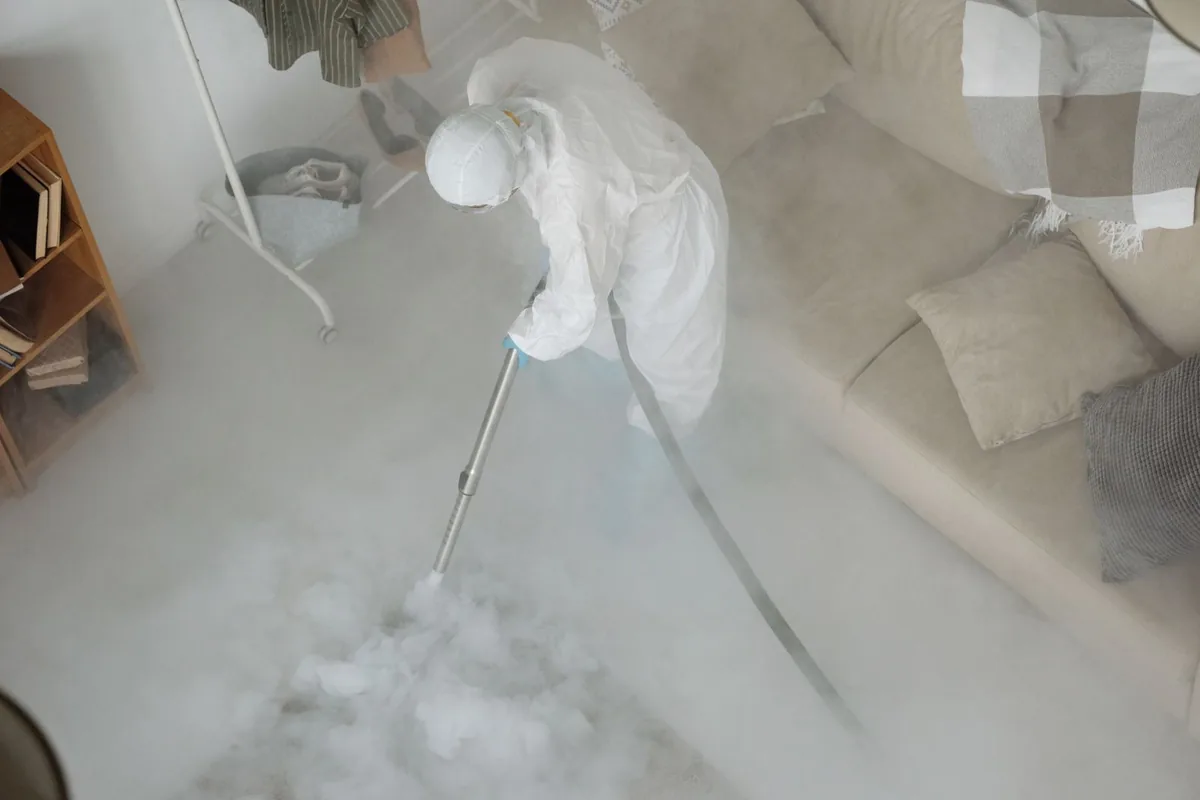 Biohazard cleanup technician in protective equipment, Yardley, PA